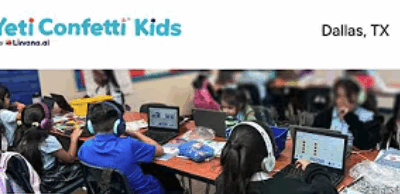 Cityscape students participate in a Yeti Confetti Kids program in Dallas, TX, sitting at a long table with laptops and headphones while engaging in collaborative digital learning activities.